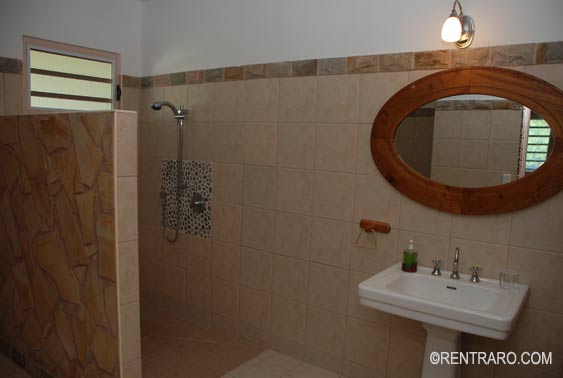 tiled bathroom and shower area at Aito Muri Rarotonga