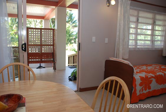from the dining area showing single bed and sliding door to the front covered veranda