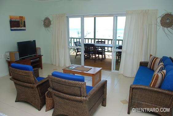 spacious living area with comfortable seating an TV and stereo