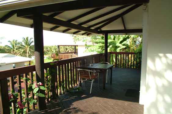 covered decks with table and chairs