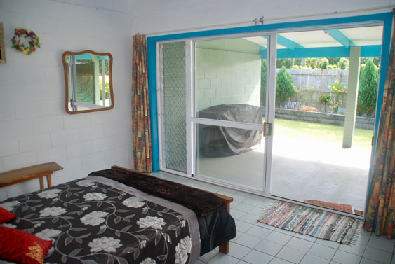 Master bedroom with sliding doors to the veranda