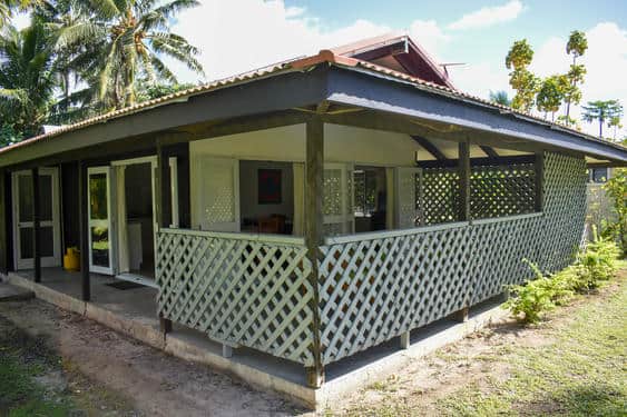 Shady verandah on two sides of the house surrounded by trellis for privacy