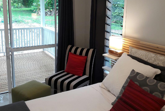 Master bedroom with sliding doors to veranda, Cook Islands 