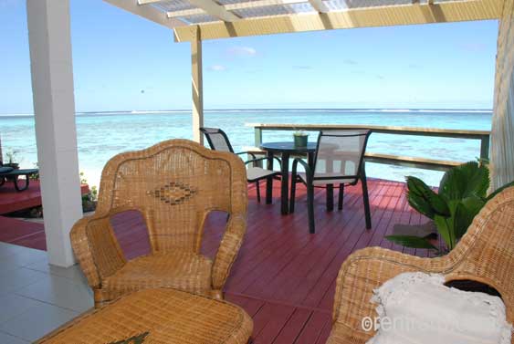 another outdoor seating area with the stunning lagoon in the background at Islander on the beach