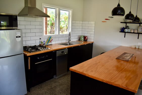 full kitchen that opens to the lounge
