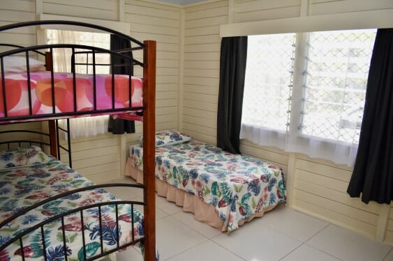 second bedroom at MAcs with bunks and a single bed