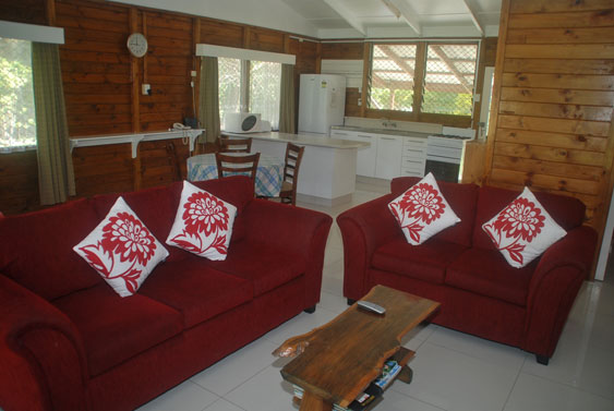 living area with lounge and dining room seating at Macs