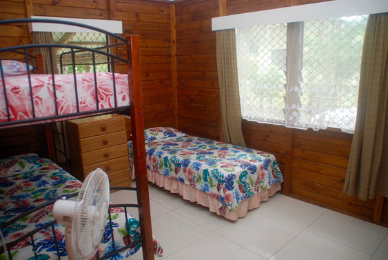 second bedroom at MAcs with bunks and a single bed